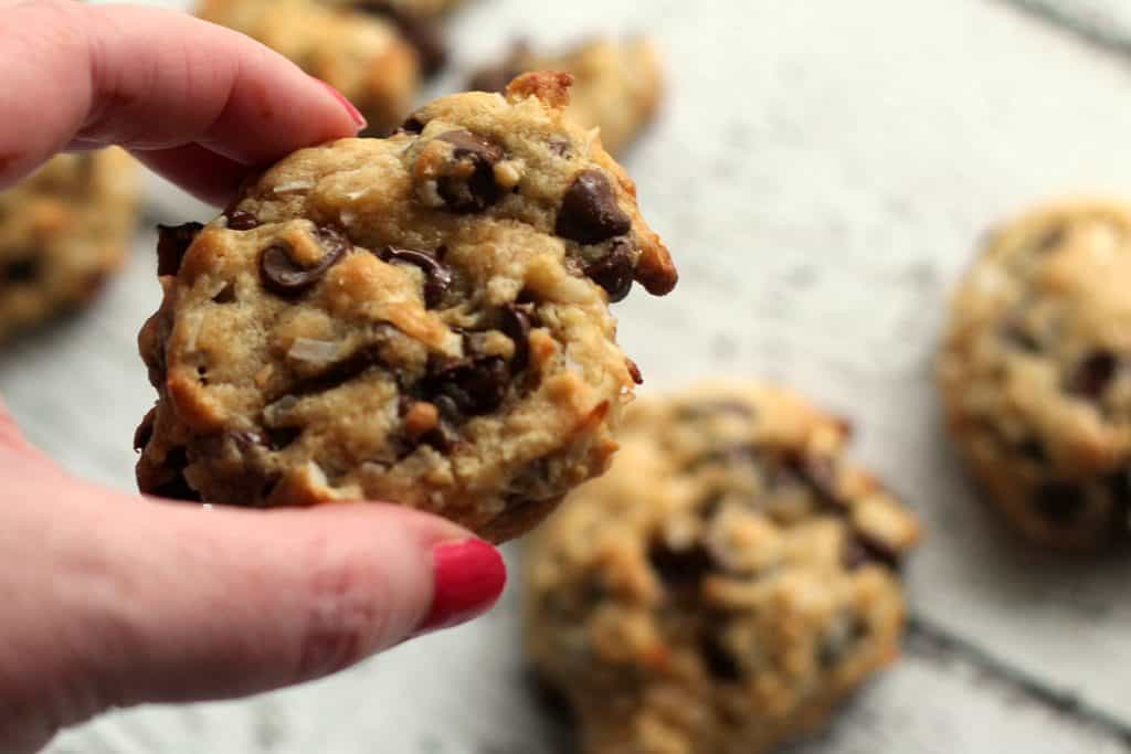 Female holding one of the baked Coconut Oil Chocolate Chip Cookies