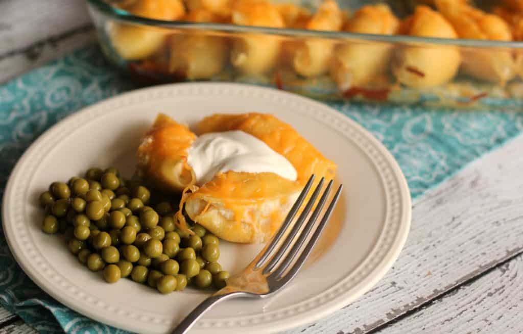 Lazy Pierogi on a plate with green peas and sour cream