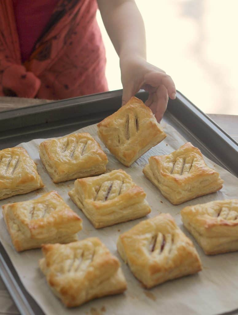 Child sneaking a Cuban Guava Pastries - Pastelitos de Guayaba y Queso
