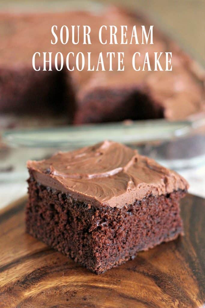 If you love chocolate, you will absolutely be in heaven with your first bite of Sour Cream Chocolate Cake! A moist, rich, not-too-sweet chocolate cake topped with decadent, creamy homemade chocolate frosting... this is chocolate perfection! | #ChocolateCake #ChocolateFrosting #SourCream #SourCreamChocolateCake #ChocolateSheetCake #Cake #SheetCake #Homemade #CountryRecipe #MomNeedsChocolate