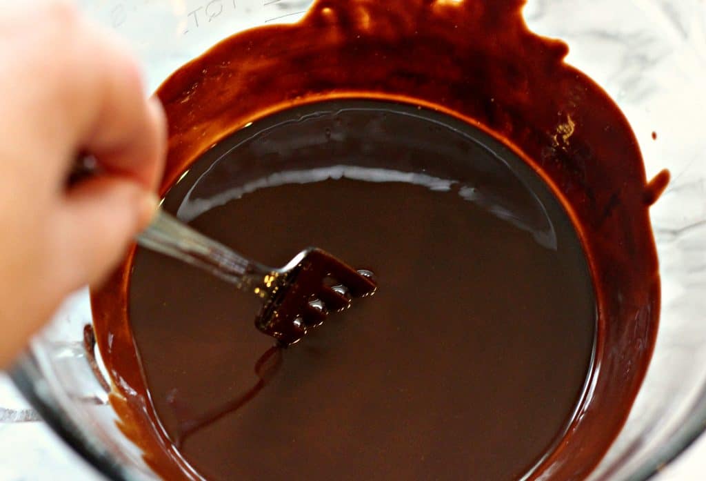 Mixing melted chocolate for Sour Cream Chocolate Cake