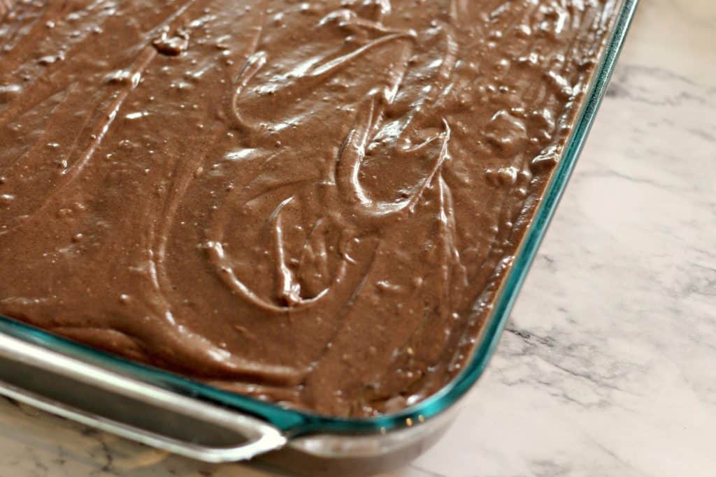 Sour Cream Chocolate Cake batter in a Pyrex dish