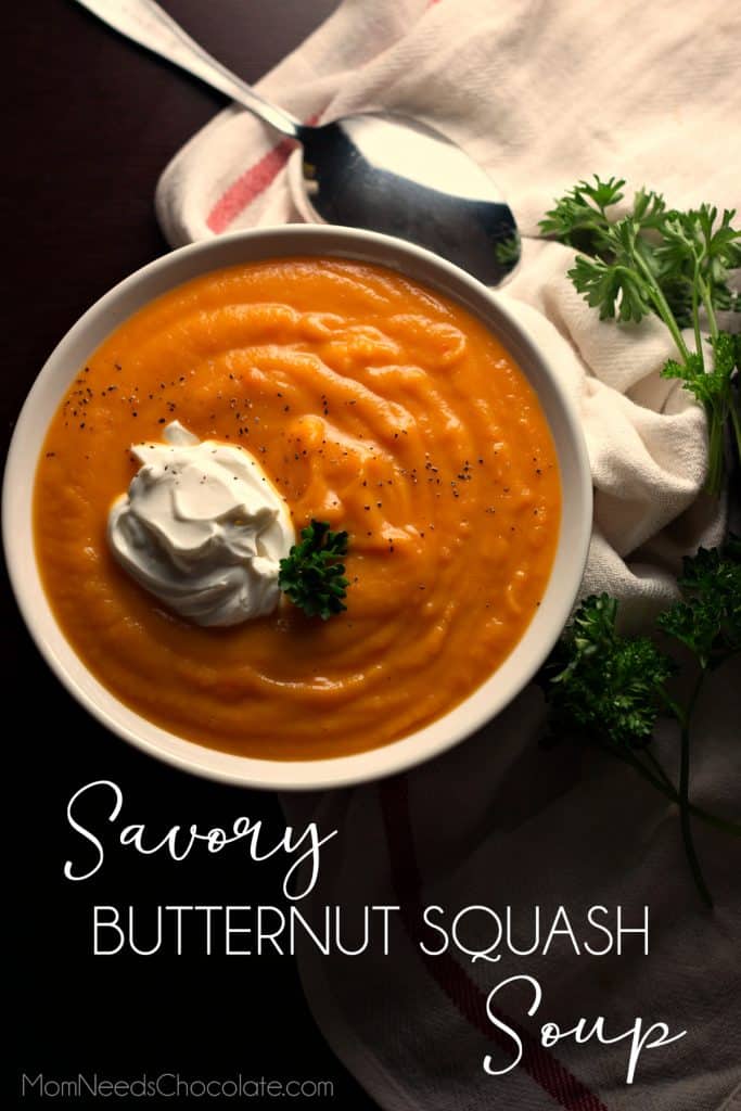 Savory Butternut Squash Soup in a white bowl with parsley on the side