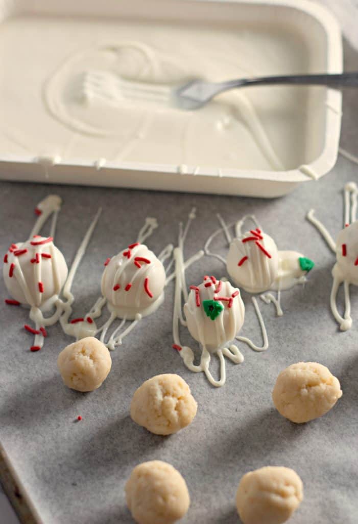 Christmas Sugar Cookie Truffles on parchment paper