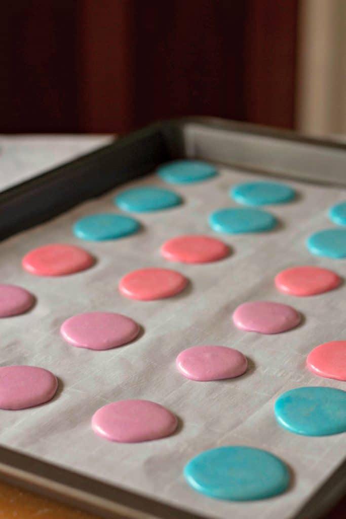 Macaron batter on a parchment paper lined baking sheet | Marshmallow PEEPS® Macaron Cookies