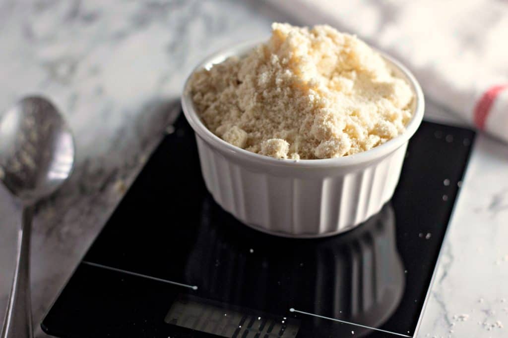 Weighing super fine almond flour on a scale for making Marshmallow PEEPS® Macaron Cookies