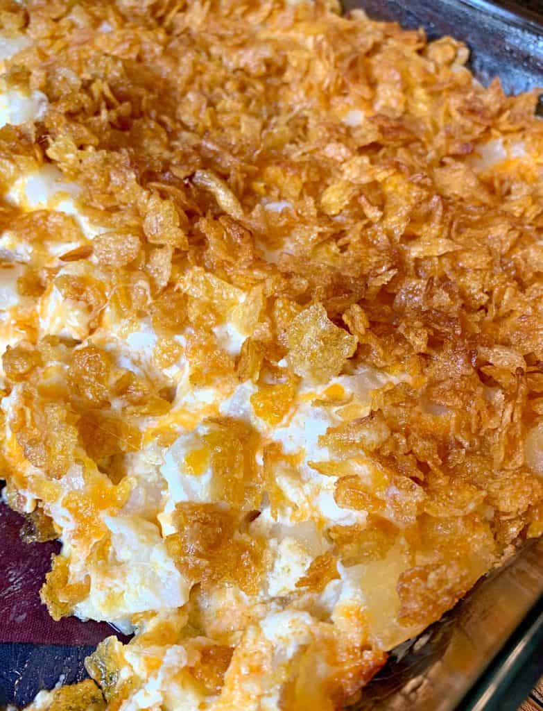 Funeral Potatoes - Cheesy Potato Casserole Topped with Corn Flakes | Funeral Potatoes is just a weird name for Cheesy Potato Casserole Topped with Corn Flakes. This is the delicious potato casserole you'll want to make for every potluck, holiday dinner, or as a special side dish for a weeknight meal. | #FuneralPotatoes #Potatoes #PotatoCasserole #SideDishes