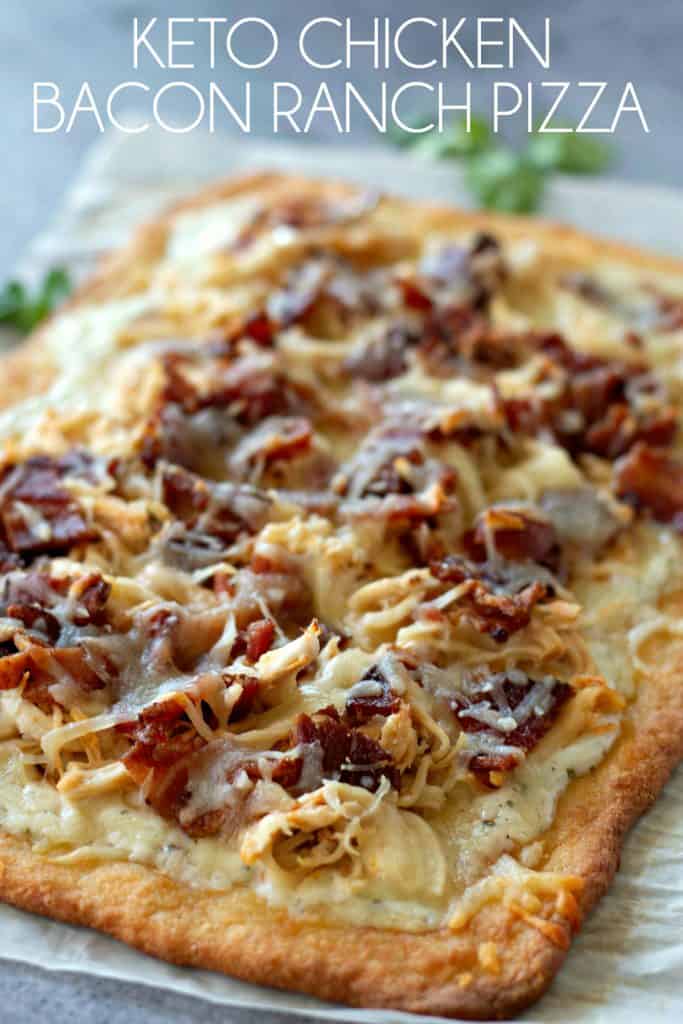 Eating low carb but missing pizza? No need to miss out! This Keto Chicken Bacon Ranch Pizza will calm your pizza craving while not messing up your eating plan. A "fat head" pizza crust loaded with shredded chicken, crispy bacon, mozzarella cheese, and creamy ranch dressing; what's not to love about this?! #Keto #KetoRecipes #KetoPizza #GlutenFree #GlutenFreePizza #GlutenFreeRecipes #LowCarb #Bacon #MomNeedsChocolate