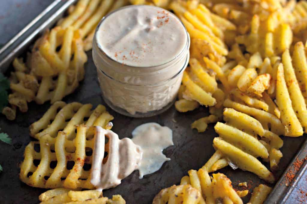 Creamy Fry Sauce Recipe with waffle fries on a sheet pan
