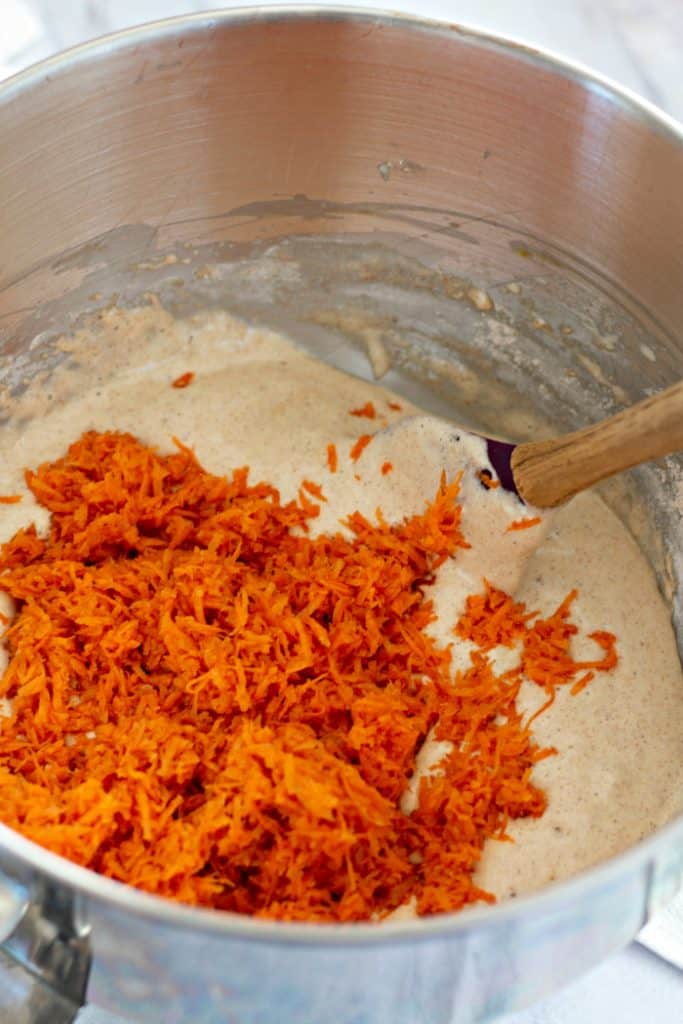 folding grated carrots into cake batter