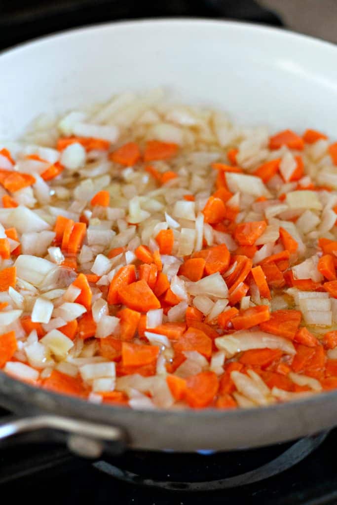 Sautéing carrots and onions in sesame oil