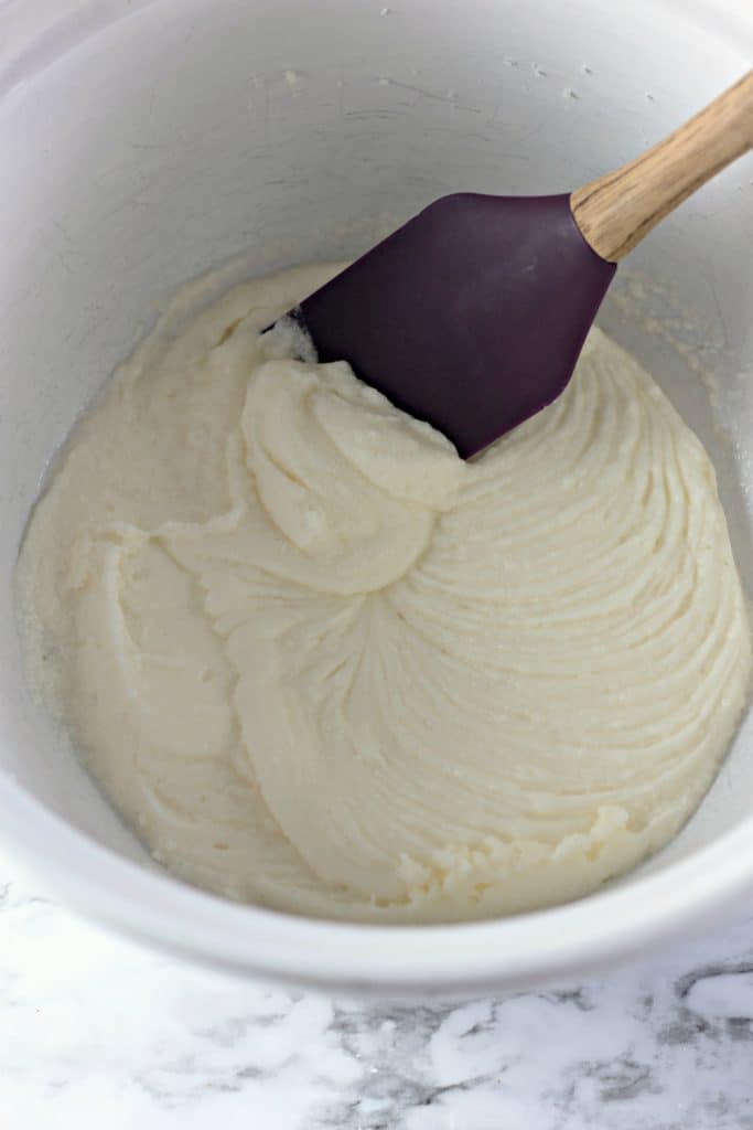 batter in a white bowl with a purple spatula