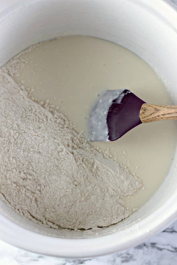 adding the flour to the batter