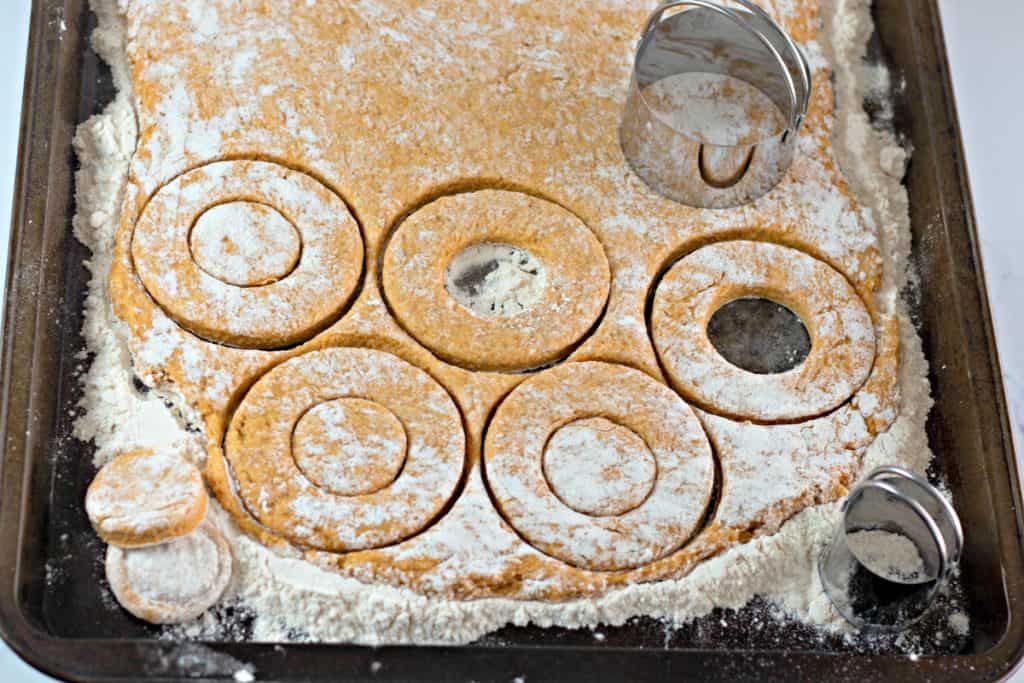 cutting donuts with a biscuit cutter