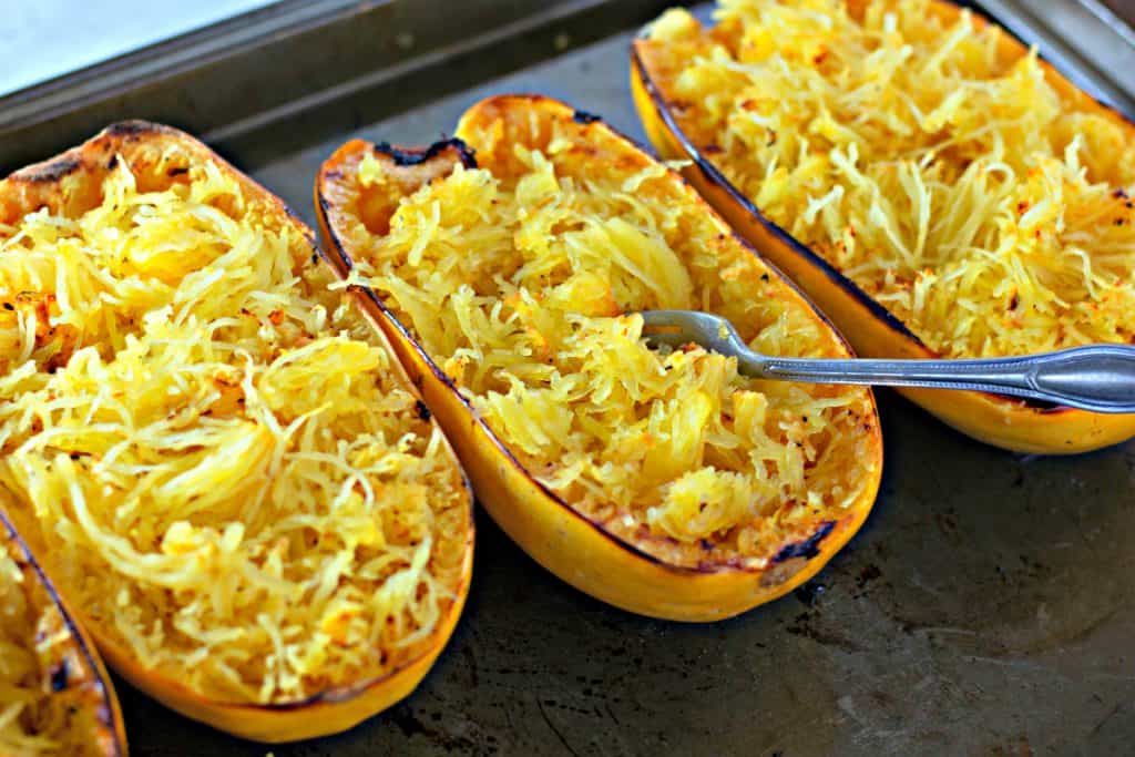 fluffing spaghetti squash with a fork