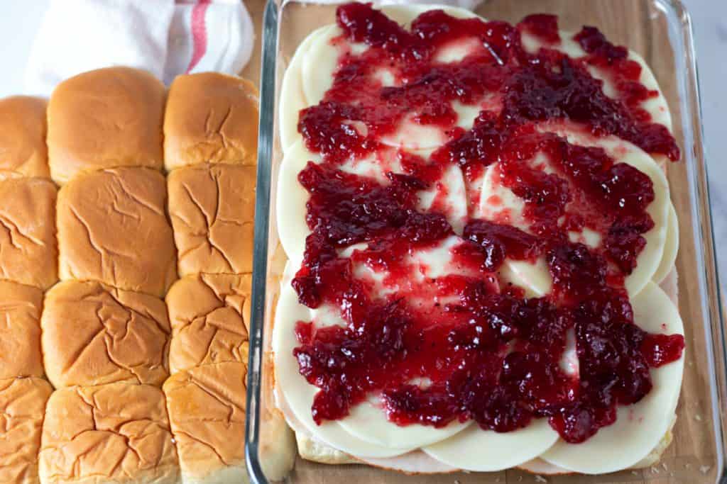 adding the layer of cranberry sauce.