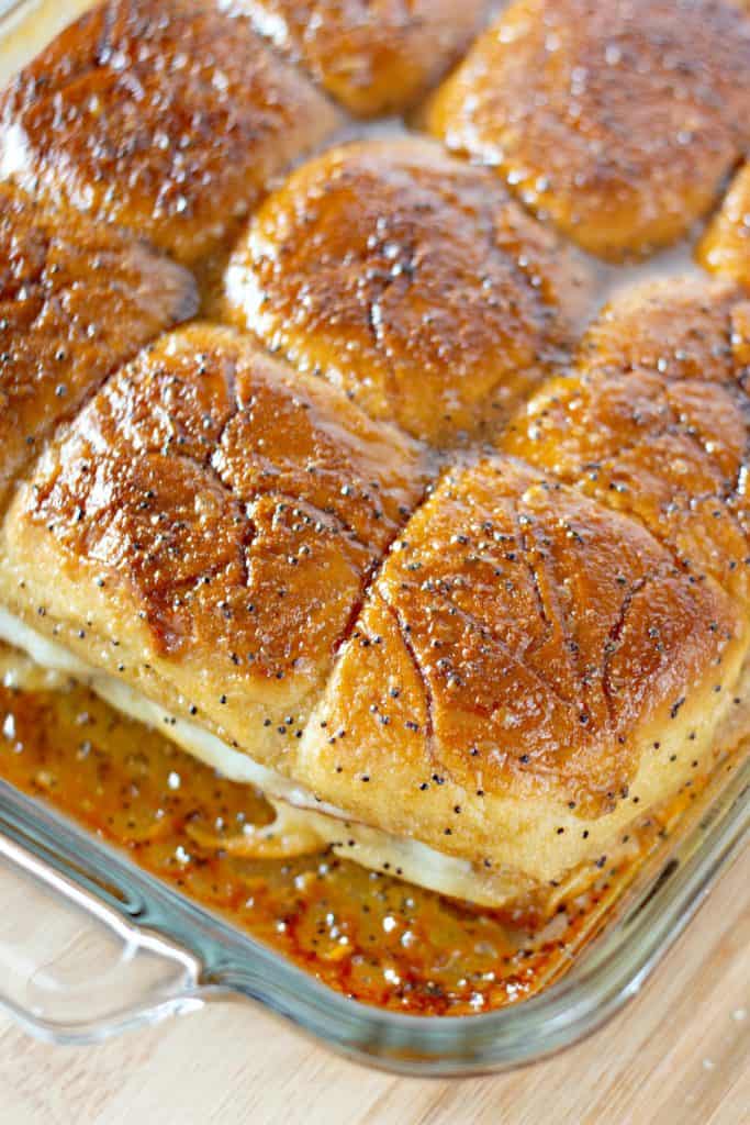 freshly baked Baked Turkey Cranberry Sliders in a Pyrex dish.